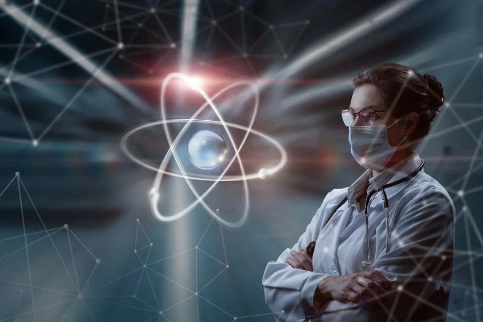 A scientist looking at a visual representation of an atomic particle