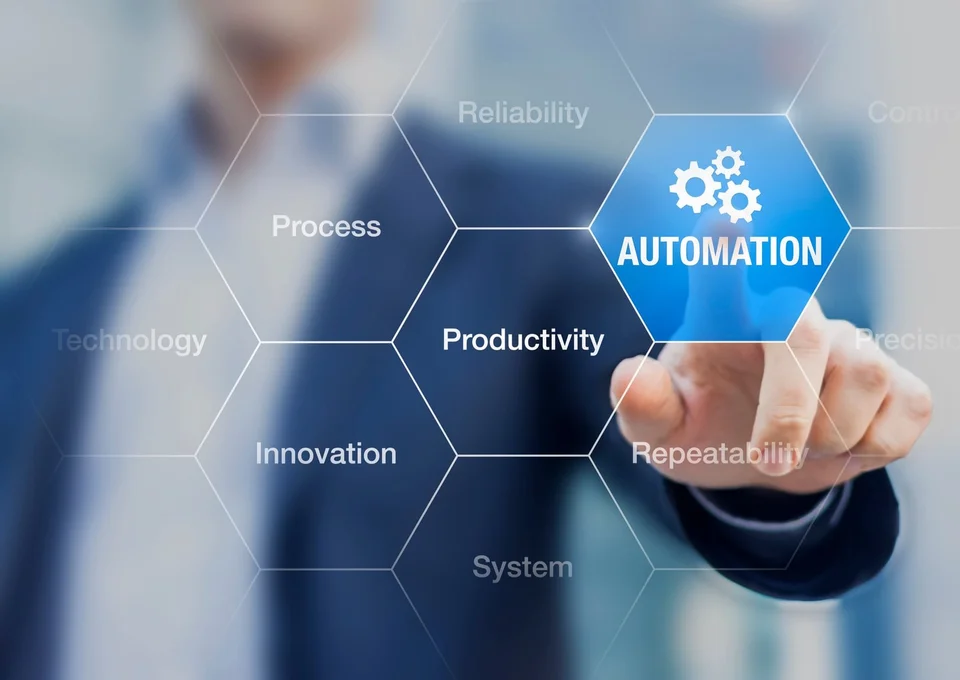 A man pressing a button labeled "Automation"